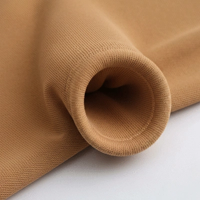 Close-up of a figure skating dress fabric showing stretch and breathability