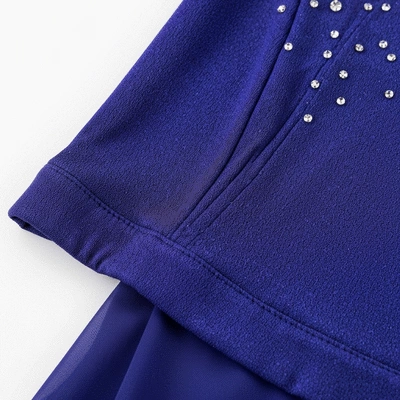 Close-up of a figure skating dress fabric showing stretch and sheen